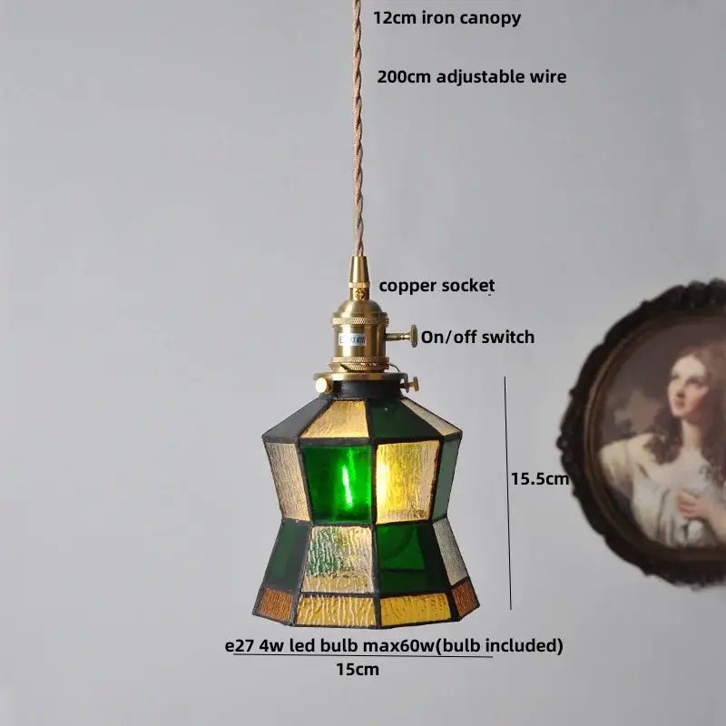 Vintage brass led pendant light with geometric stained glass shade in amber and teal, suspended by copper wire canopy