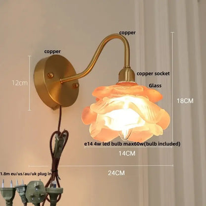 A warm-toned flower-shaped glass lamp with copper brass led wall sconce and decorbites brass led pull chain mount