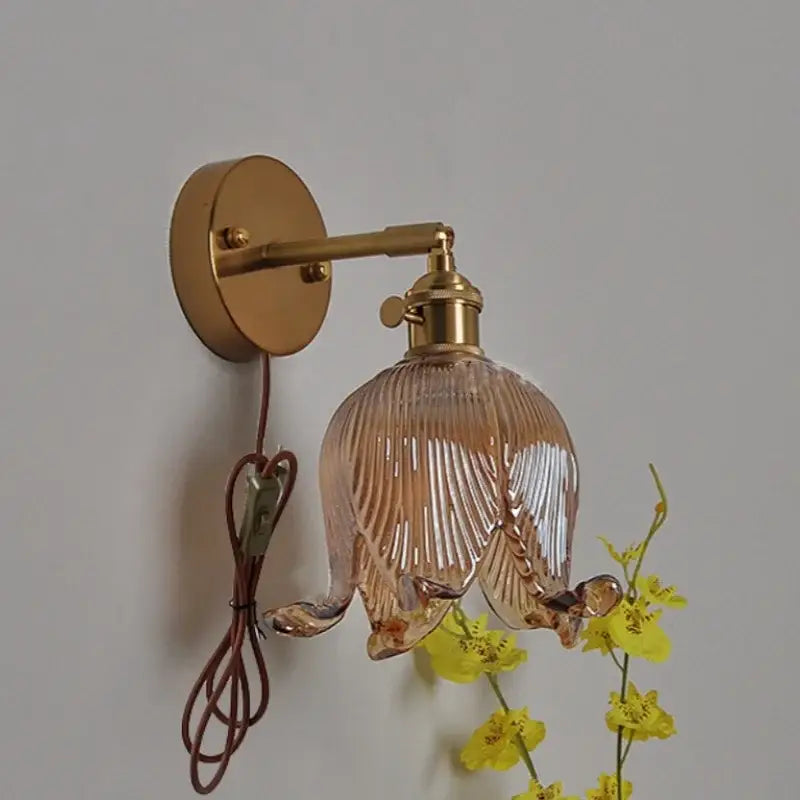 A delicate vintage brass loft amber glass wall light with a gold-toned flower sconce for bedroom decorbites loft amber