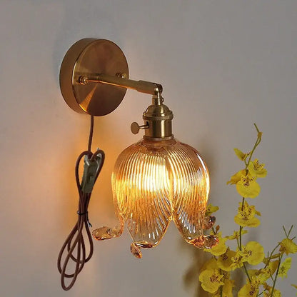 A warm-toned loft amber glass wall light with ribbed design and vintage brass hardware for bedroom decorbites loft amber