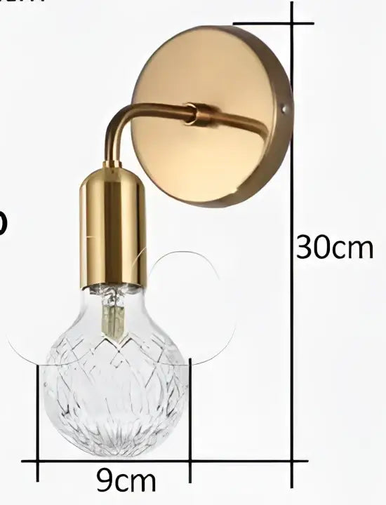 Gold-toned vintage brass pendant lamp with faceted crystal bulb designed as a brass pendant lamp for dining room