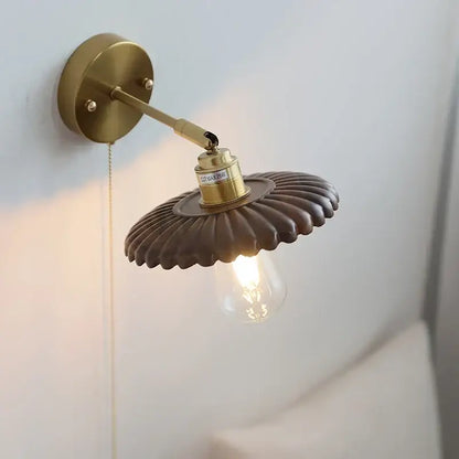 Vintage brass scalloped wall lamp with fluted dark brown shade and exposed edison bulb light fixture for bedroom