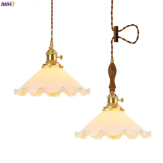 Two vintage brass led pendant lamps with scalloped warm frosted glass shades for bedroom lighting