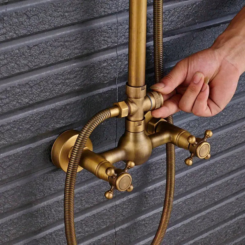 Vintage brass shower faucet mixer set featuring a bathroom rainfall head shelf with two cross-handle knobs and braided hoses