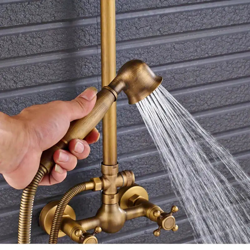 Antique brass shower faucet mixer set with handheld showerhead and wall-mounted faucet mixer for vintage bathroom use