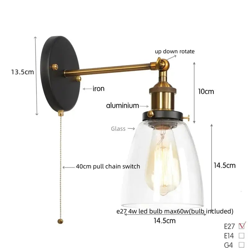 Vintage brass wall light fixture with black iron backplate, brass arm, and clear glass dome for bedroom use