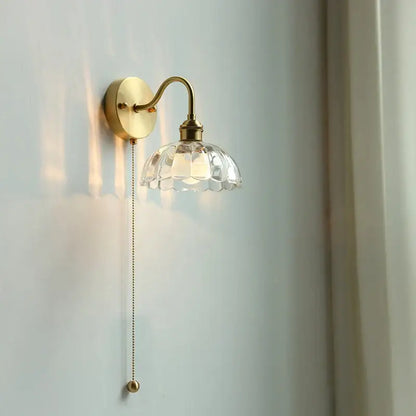 Vintage brass wall sconce with scalloped clear glass shade and ornate pull chain ideal for stairways decorbites clear glass