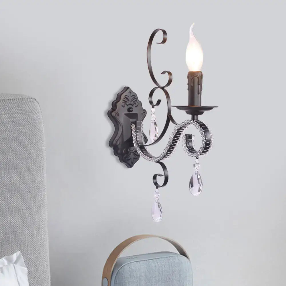 Antique bronze wrought iron wall mounted lamp with crystal teardrop pendants and candle style bulb for living room