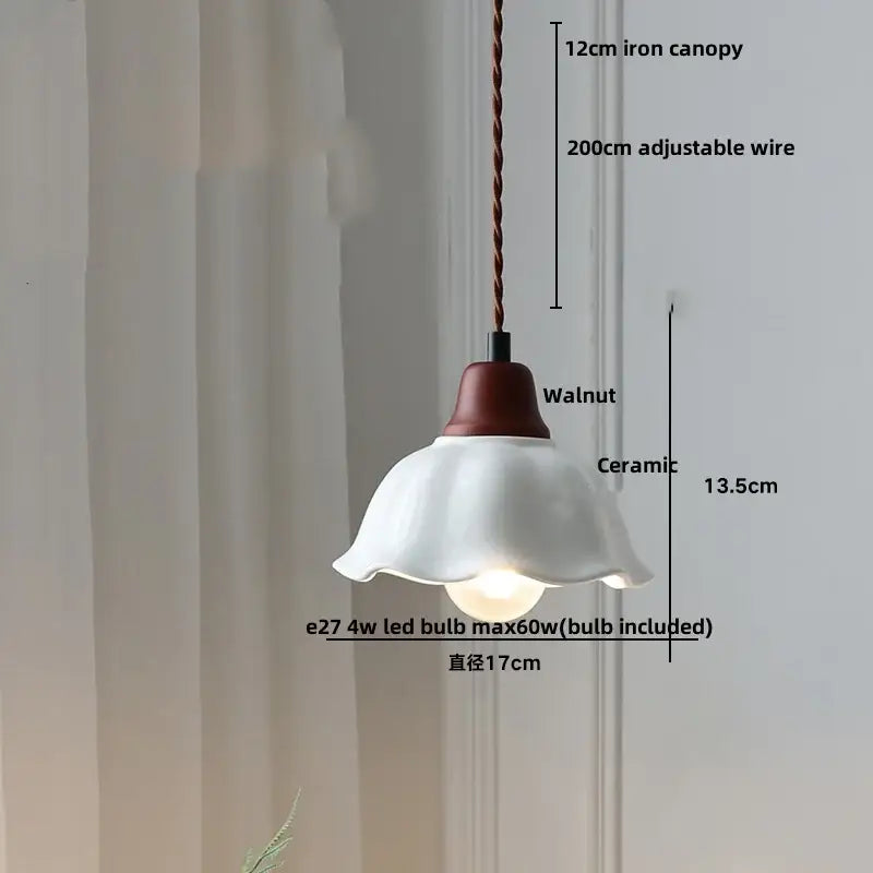 A delicate white ceramic pendant light with fluted shade and dark walnut metal top for decorbites brown wood ceramic decor