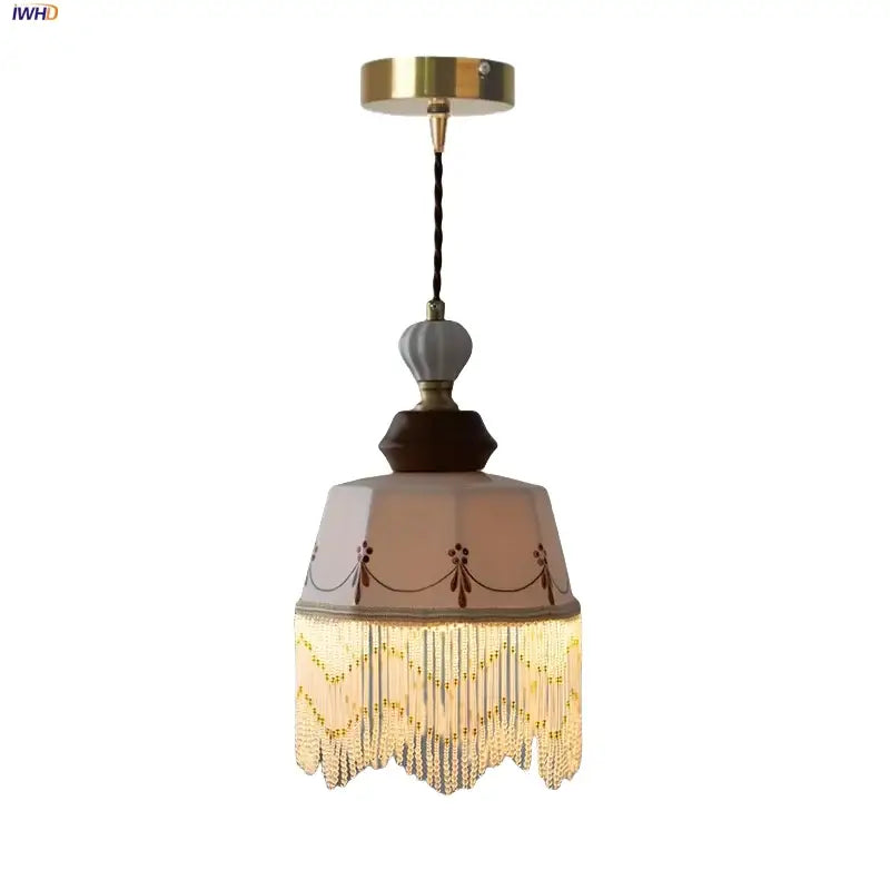Vintage brown wood ceramic pendant lights featuring a beige glass shade with brown patterns and golden beaded fringe decorbites brown wood