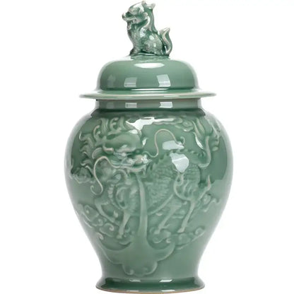 Vintage celadon green porcelain tea caddy with dragon relief carvings and mythical beast lid for kitchen storage jar