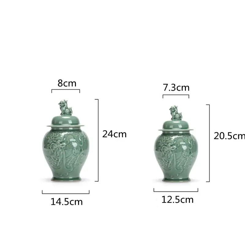 Two jade green ceramic tea caddies with intricate dragon relief and lion lid storage jars in vintage celadon porcelain