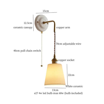 Vintage ceramic and brass wall sconce with adjustable led copper arm and pleated off-white ceramic shade by decorbites