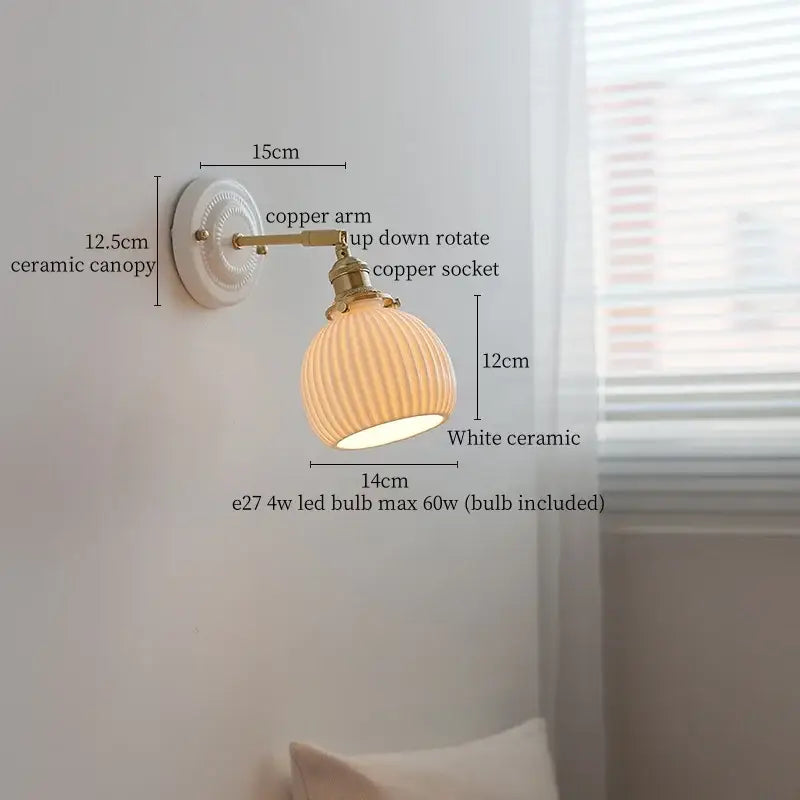 White ceramic and brass wall sconce light with ribbed glass shade and pull chain for vintage bedroom decor