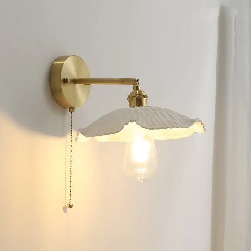 Vintage ceramic copper led wall light with brushed brass finish and off-white scalloped ruffled shade for bedroom decor