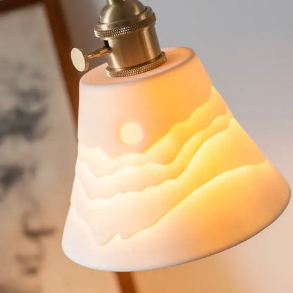 Vintage ceramic led pendant light with warm-toned sculpted sunrise lampshade on antique brass decorbites ceramic led fixture