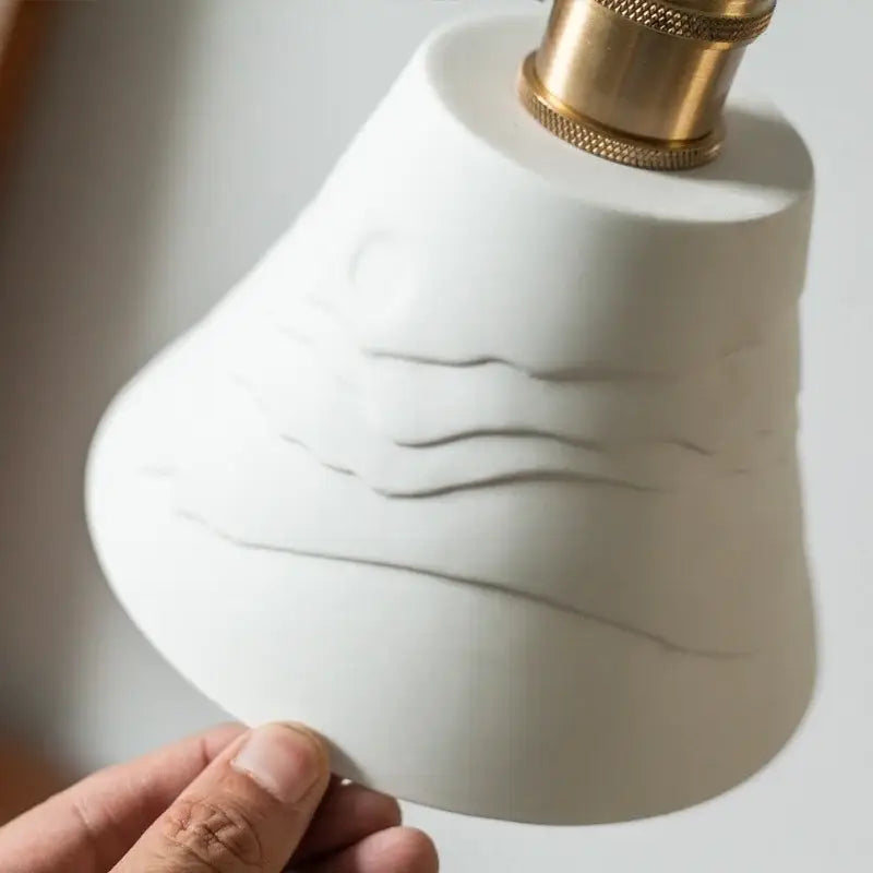 Vintage white ceramic led pendant light with wavy embossed lines and brass finish for kitchen decorbites ceramic led