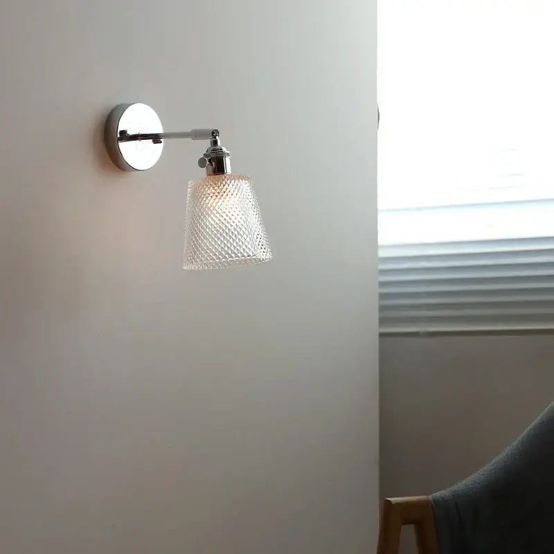 A vintage chrome clear glass wall sconce with a sleek chrome finish and textured clear glass shade decorbites clear glass