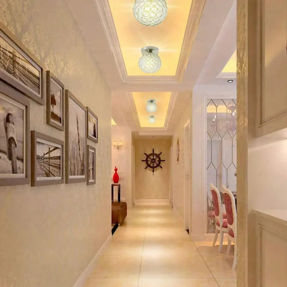 The hallway showcases a vintage chrome crystal ball ceiling light with frosted glass globes and recessed lighting decorbites ceiling light