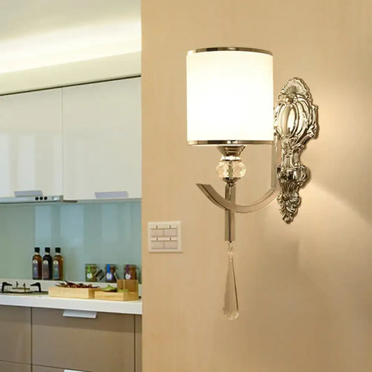 Elegant silver-toned vintage chrome wall sconce with carved backplate, white fabric shade, crystal accents for corridor lighting