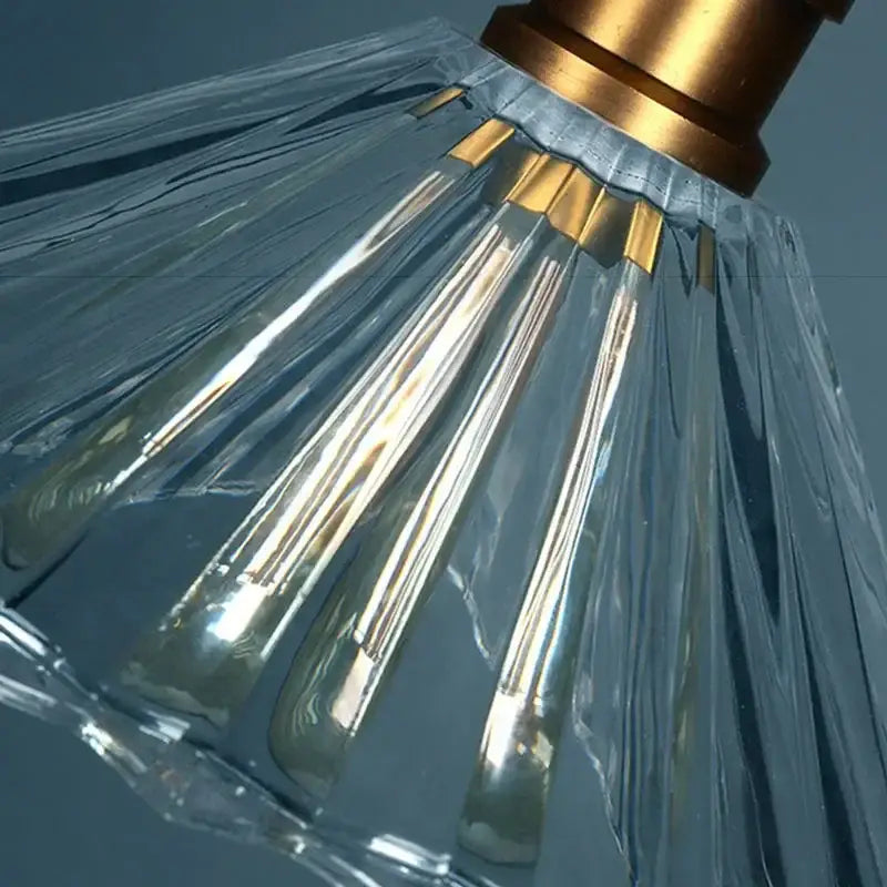Vintage clear stripe glass hanging light with a faceted clear glass lampshade and gold-toned brass fixture decorbites clear stripe
