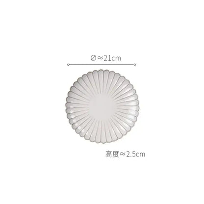 Translucent white ceramic plate with scalloped edge and radial ridges from vintage cream scalloped dining table set