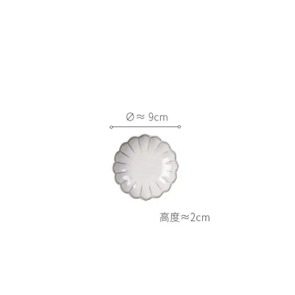 Delicate vintage cream scalloped white ceramic dish with glossy finish from dining table set for elegant dining table use