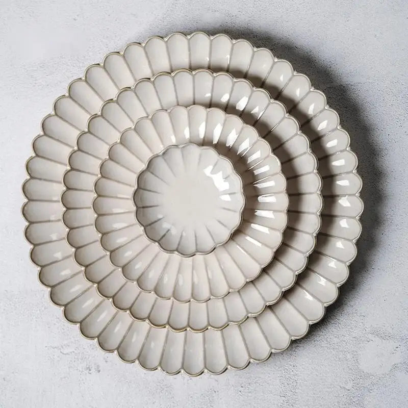 Set of three cream ceramic plates with scalloped petal rims for vintage cream scalloped dining table set