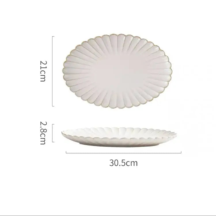 Vintage cream scalloped ceramic dining table set featuring a white ceramic platter with gold trim for dining table use
