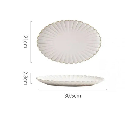 Vintage cream scalloped ceramic dining table set featuring a white ceramic platter with gold trim for dining table use