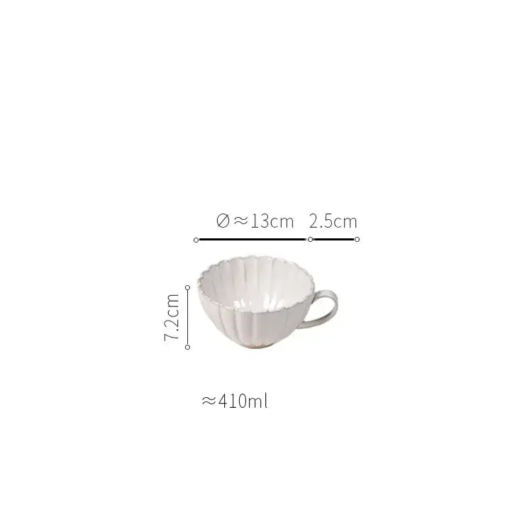 White ceramic cup with fluted petal ridges and handle from vintage cream scalloped ceramic dining table set