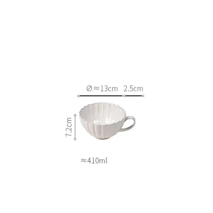 White ceramic cup with fluted petal ridges and handle from vintage cream scalloped ceramic dining table set