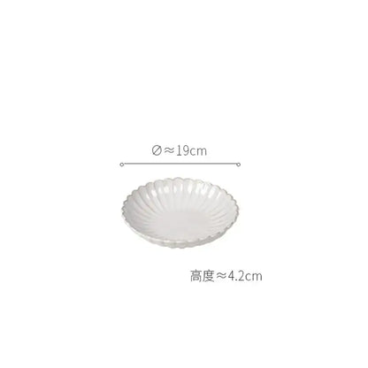 Vintage cream scalloped ceramic dish with subtle ridged texture from a dining table set for elegant dining room trim
