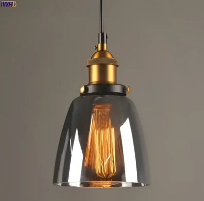 Industrial-style glass pendant lights set of 4 with dark smoked glass shades and brass-finished metal hardware for dining rooms