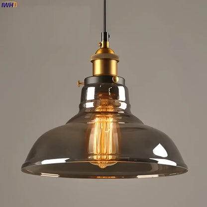 Vintage dark glass pendant lights set of 4 with smoked glass shades brass accents and exposed edison bulbs for dining rooms