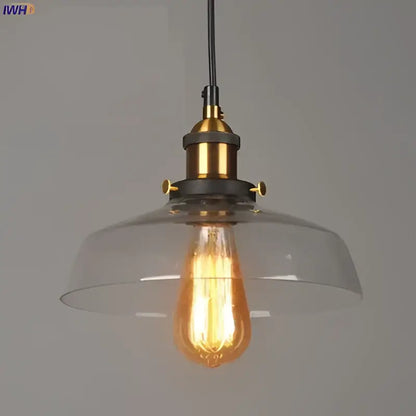 Vintage dark glass pendant lights set of 4 with brass accents featuring clear glass pendant and exposed edison bulbs
