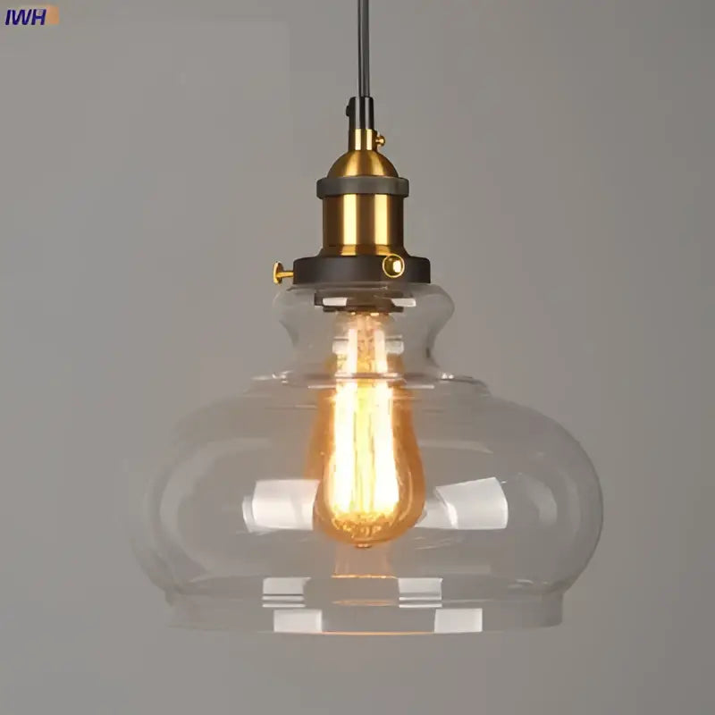 Clear glass pendant lights with brass-finished metal fixtures and exposed edison bulbs set of 4 for dining rooms