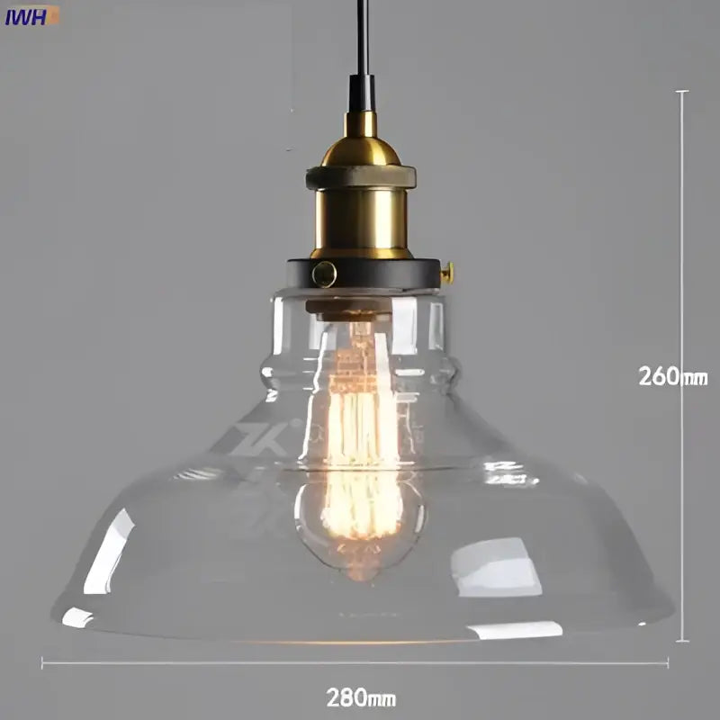Clear glass pendant light with brass-finished metal fixture and exposed filament bulb in vintage dining room set of 4 pendant lights