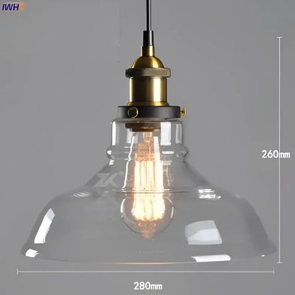 Clear glass pendant light with brass-finished metal fixture and exposed filament bulb in vintage dining room set of 4 pendant lights