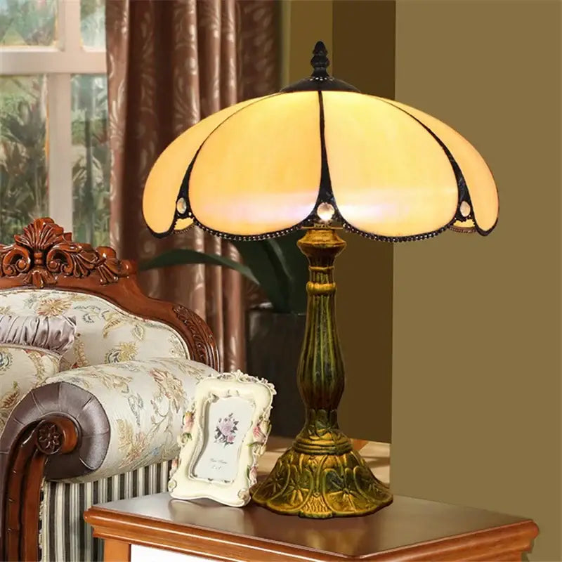 Vintage dragonfly tiffany stained glass table lamp with warm amber stained glass shade and ornate brass base for bedroom desk