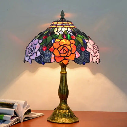 Vintage dragonfly tiffany stained glass table lamp with vibrant orange pink purple roses on deep blue shade