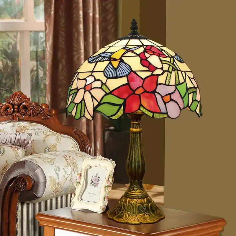 Vintage dragonfly tiffany stained glass table lamp with multicolored floral and hummingbird panels on bronze base
