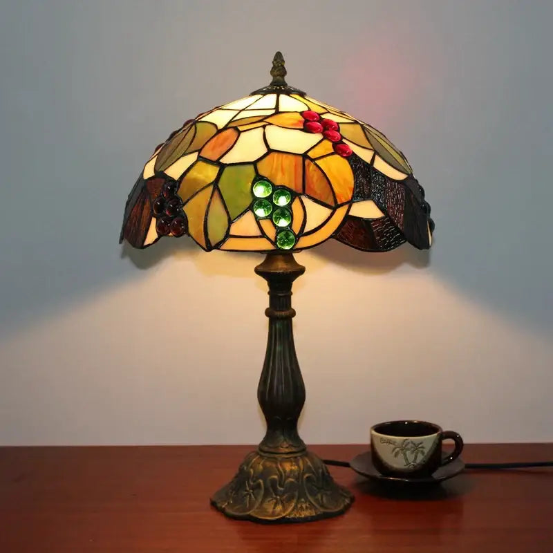 Vintage dragonfly tiffany stained glass table lamp with amber green cream panels and grape leaf motif for bedroom desk lighting