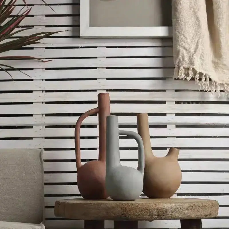 Three earthy terracotta gray beige geometric stoneware vases with rounded bodies and handles for living room decorbites decorbites geometric stoneware