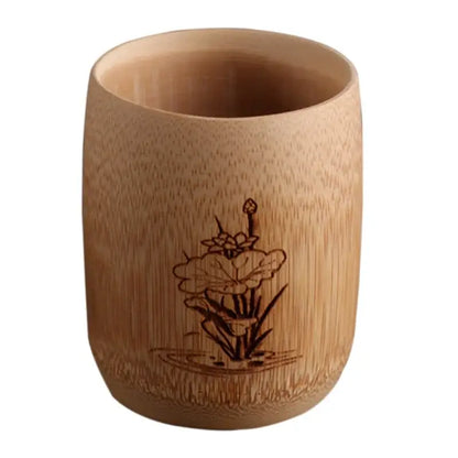 A light brown bamboo drinking cup with a delicately engraved lotus flower in a vintage drinking cup set decorbites
