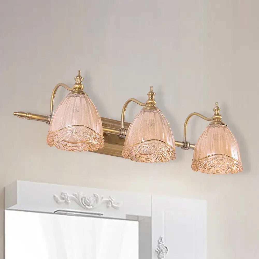 Three-light vintage floral amber glass wall sconce with rose-tinted etched glass shades and brass-finished metal arms