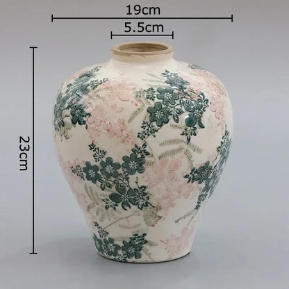A cream-colored ceramic vase with cracked texture blue floral patterns for living room decorbites cracked texture decor
