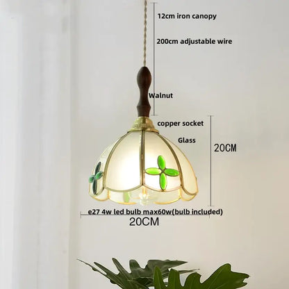 Delicate tiffany-style pendant lamp with cream glass shade, green floral motifs, dark walnut iron canopy by decorbites copper wire glass