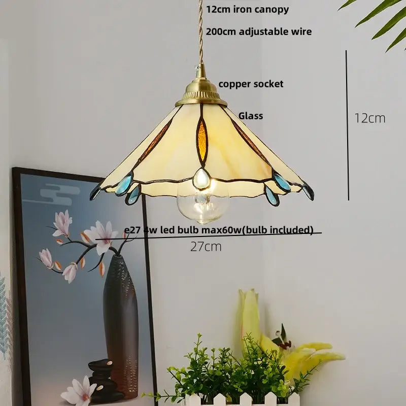 Tiffany-style pendant lamp with brass canopy, cream amber teal stained glass shade, suspended by decorbites copper wire glass