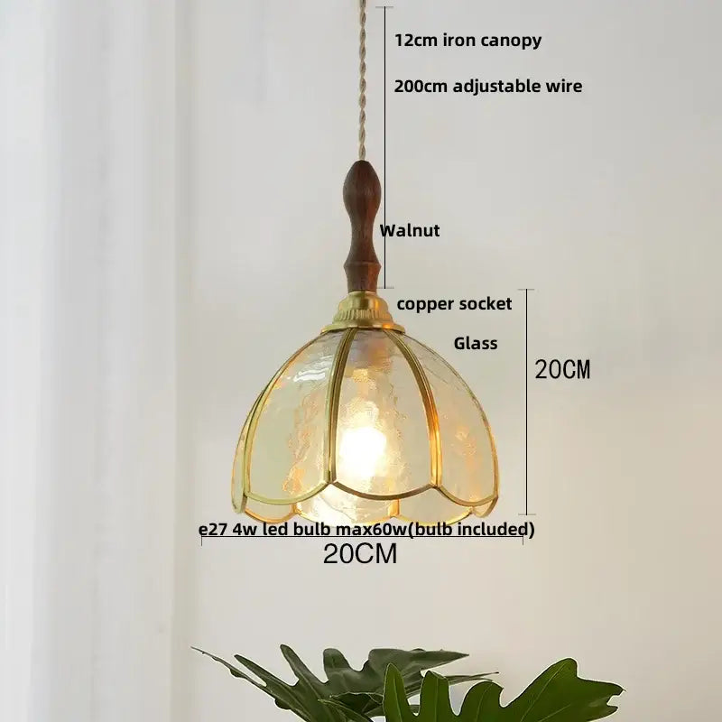 A warm-toned vintage floral glass pendant lamp with walnut iron canopy and copper wire glass decorbites copper wire socket